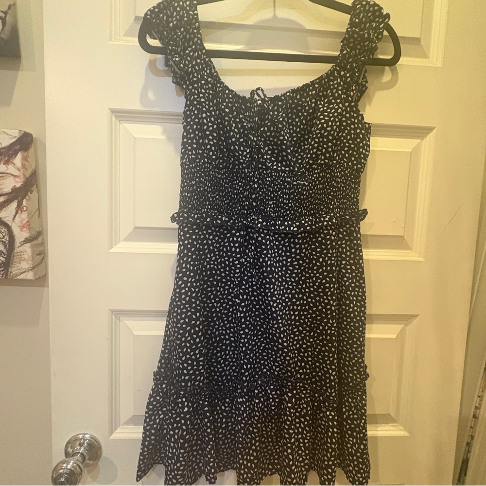 Navy/white polka dot ruffle mini dress.